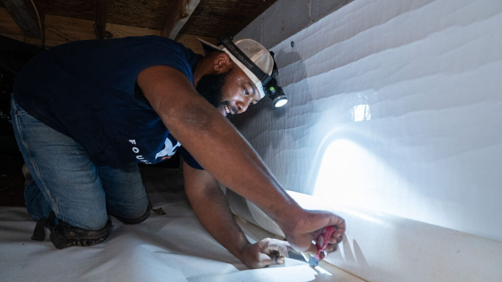 Putting in a crawl space vapor barrier