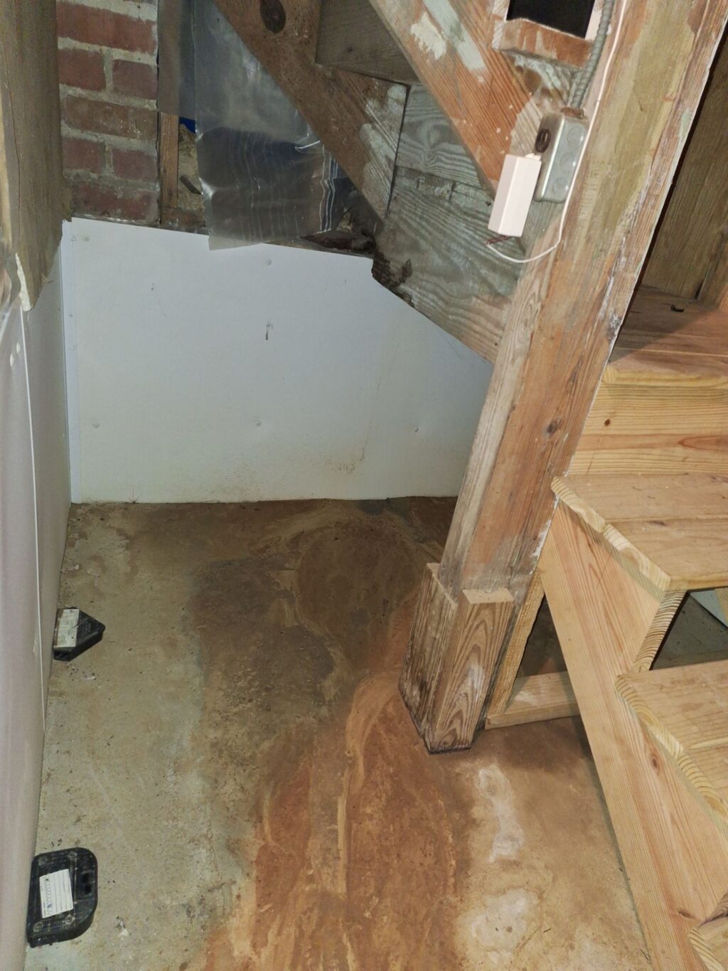 Water stains on a basement floor.