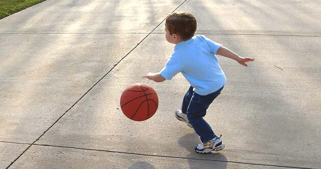 Kid playing basketball